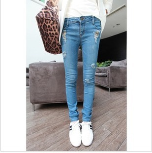 New all-match distrressed rivet solid color denim pencil hole jeans pants